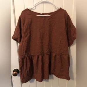 Tradland’s Nico Short Sleeve Peplum in the color Plum. Size is 2x.